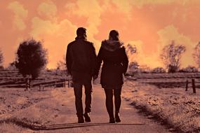 romatic couple walks in a winter park