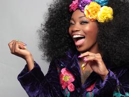 Picture of laughing beautiful woman with flower wreath