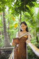 asian girl with clay pot