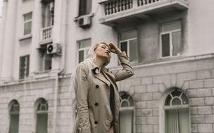 photo of a pensive blonde on a city street