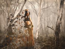 mystical photo of a girl and autumn leaves in a foggy forest