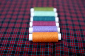 colorful Sewing Threads on fabric