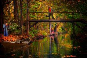 couple in love on the bridge in the forest