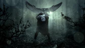 mystical photo of a girl and a bird of prey in a spooky forest