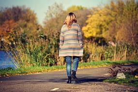 back view of Woman Walking on Road