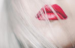 blonde with bright red lips close up