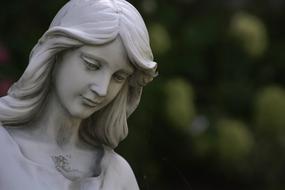 female statue on a blurred background