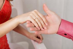 Hands of the couple with the rings