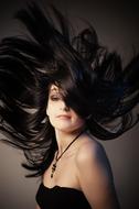 photo portrait of a girl with tousled long black hair