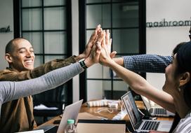 Achievement of Agreement, four people hand to hand