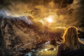 girl looks at the colorful mystical sunset