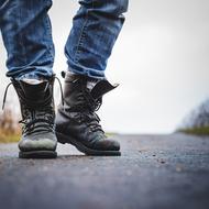old leather shoes and jeans on the feet