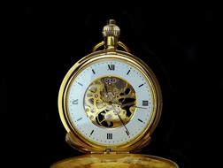 antique golden Pocket Watch at darkness