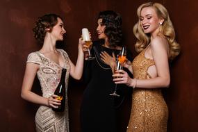 Three young sexy girls with champagne