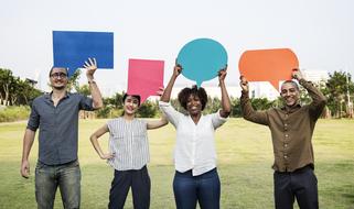 multinational team with multicolored paper speech bubbles