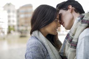 photo of a kiss of a girl and a young man