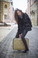 young woman with vintage suitcase