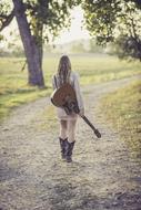 Young girl with Guitar on Country Road