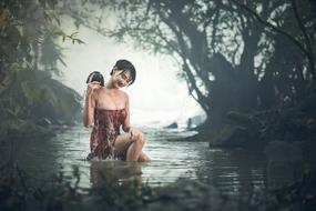 beautiful young asian girl bathing outdoor