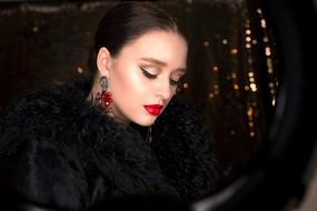 photo of a girl in a black coat