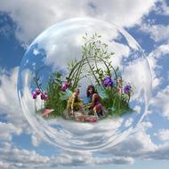 Fees, two winged young girls inside soap bubble at sky