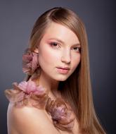 model with delicate makeup and flower garland
