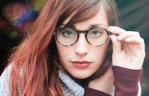 young girl in round Glasses