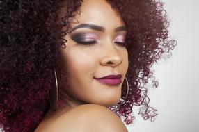 photo of a woman with eggplant curly hair