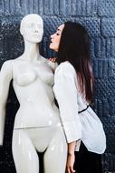 brunette kisses mannequin