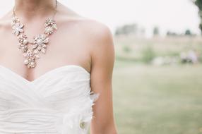 girl in wedding dress and necklace