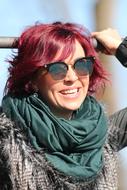 happy adult red haired woman in Sunglasses