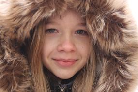 smiling girl in hood