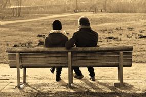 couple sitting on the park bench