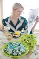 Breakfast, young lady at table with Shamrock Cookies