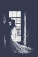 black and white photo of the newlyweds in an abandoned building