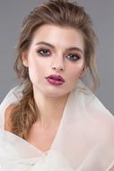 Young sensual Woman with white scarf on shoulders