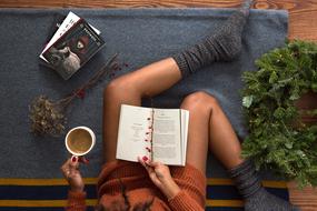 woman reading with black coffee