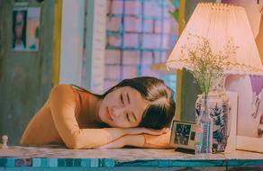 Asian sad girl lies on the table