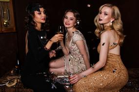 girls in beautiful retro dresses at a party