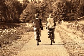 monochrome, couple riding bicycles