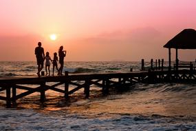 happy family on the pier