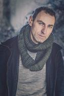 photo of a brutal man with a scarf around his neck