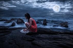 Woman Beauty on Rock in sea