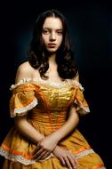 Lovely Woman in vintage golden dress, portrait