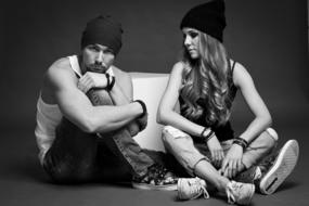 cool Girl and Guy sitting on floor