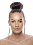 girl with a high hairstyle and long earrings