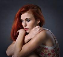 thoughtful woman with red hair