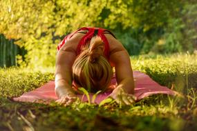girl doing yoga in nature