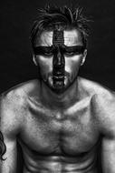 Man with painted face, black and white