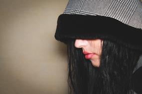 brunette hides her face under the hood